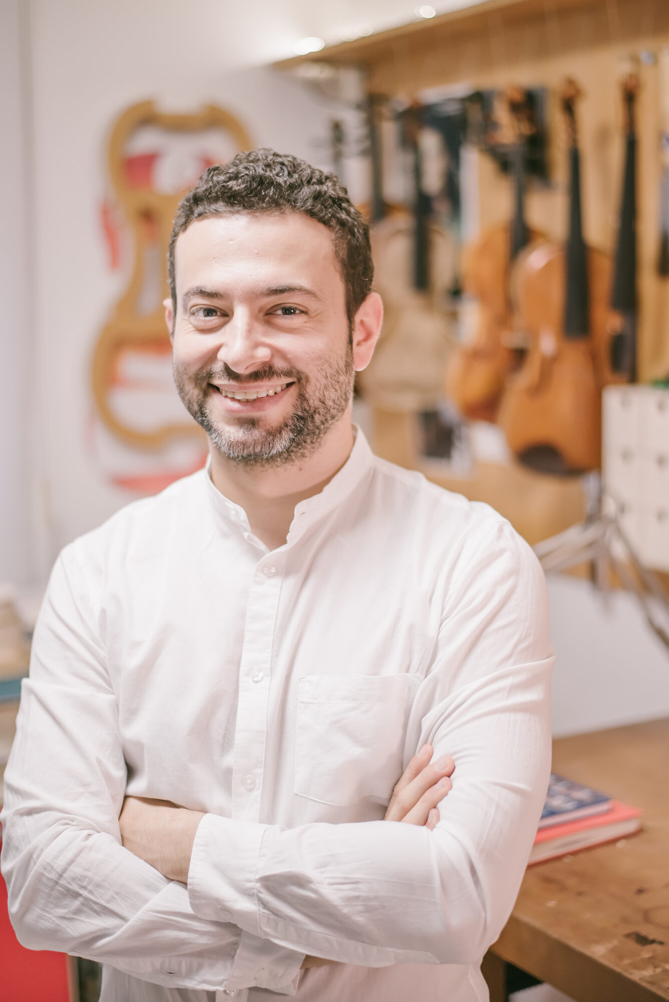 Portrait of Erli Gurra in his violin workshop